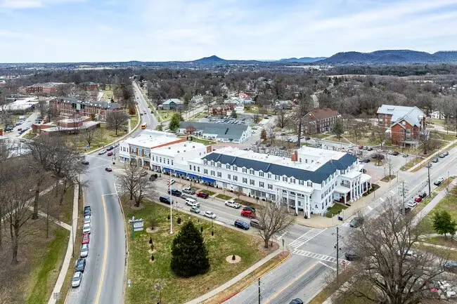 Aerial view of downtown Berea, KY, featuring the large white Boone Tavern building at a busy intersection, ideal for businesses seeking custom Website Design Berea KY.