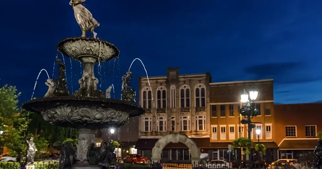 A close-up of a fountain in Bowling Green, Kentucky, with water flowing under the evening sky, perfect for Website Design Bowling Green KY.