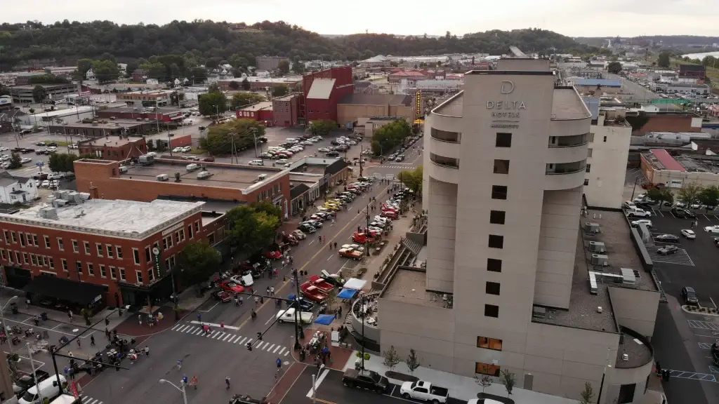 Drone shot overlooking a crowded downtown street fair or event next to the large Delta Hotel and low-rise buildings in Ashland, KY, needing strong Website Design Ashland KY.