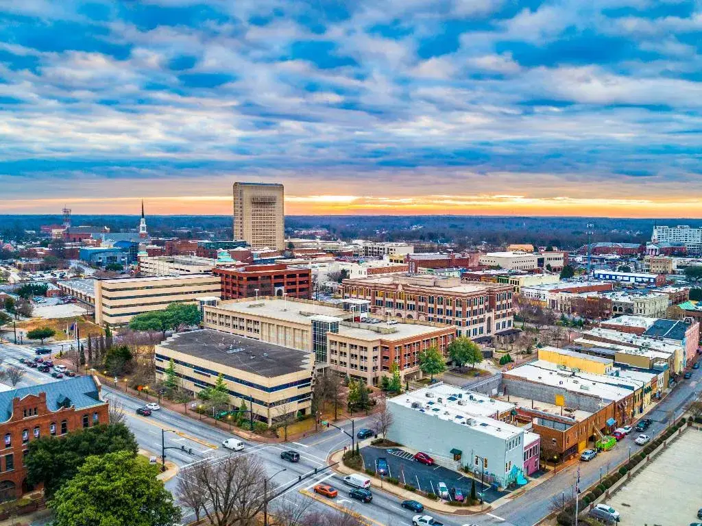 A beautiful aerial view of downtown Spartanburg SC at sunset, showcasing the cityscape and vibrant colors, ideal for Website Design Spartanburg SC.