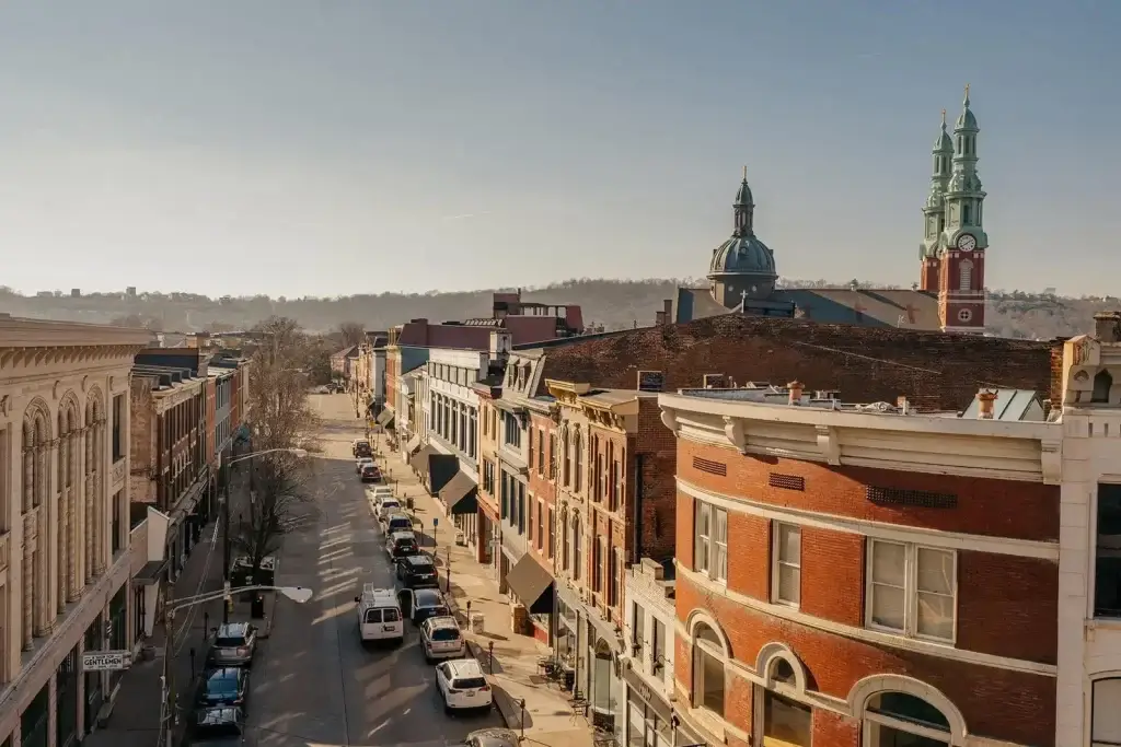 A picturesque street scene of Covington, showcasing the city's charming buildings and clock tower, perfect for Website Design Covington KY.