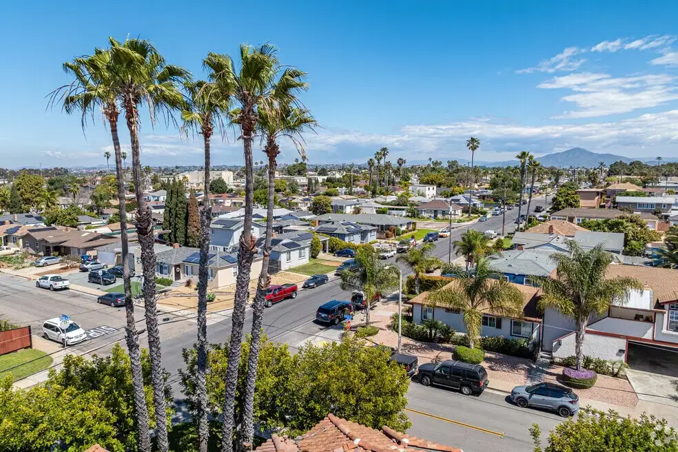 Residential street scene with palm trees and distant hills near Website Design Chula Vista CA professionals.