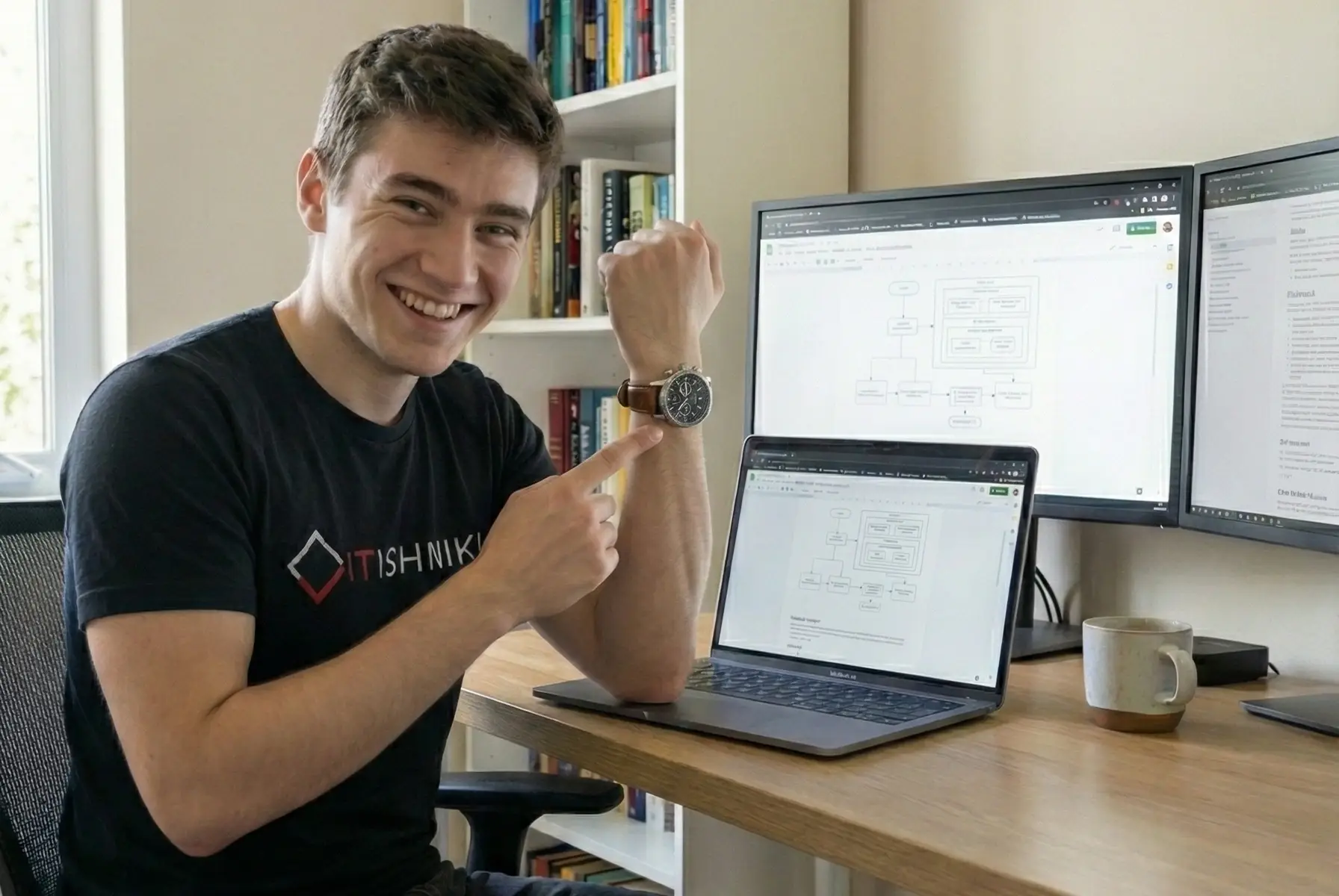 Cheerful professional pointing to his wristwatch to indicate the timely delivery of his Elementor project