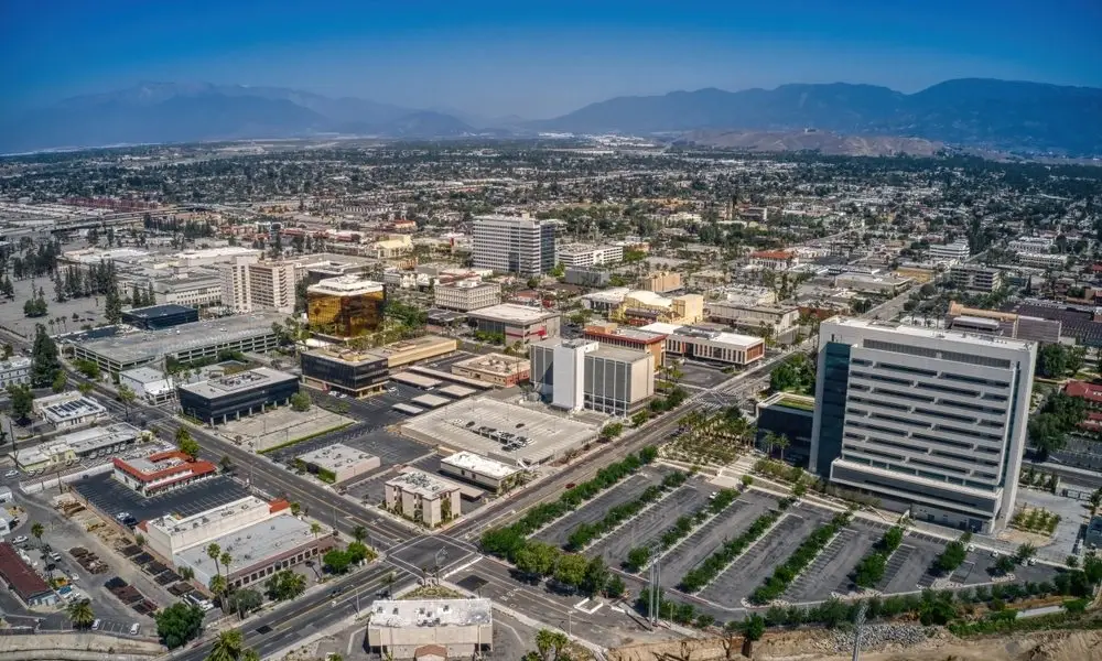 Aerial view of San Bernardino high-rise offices and empty lots near the mountains and Website Design San Bernardino CA experts.