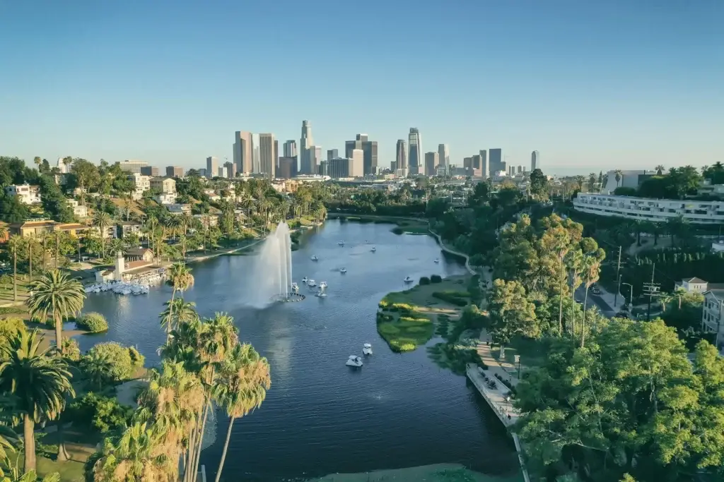 Sunny view of Echo Park Lake fountain and skyscrapers near Website Design Los Angeles CA