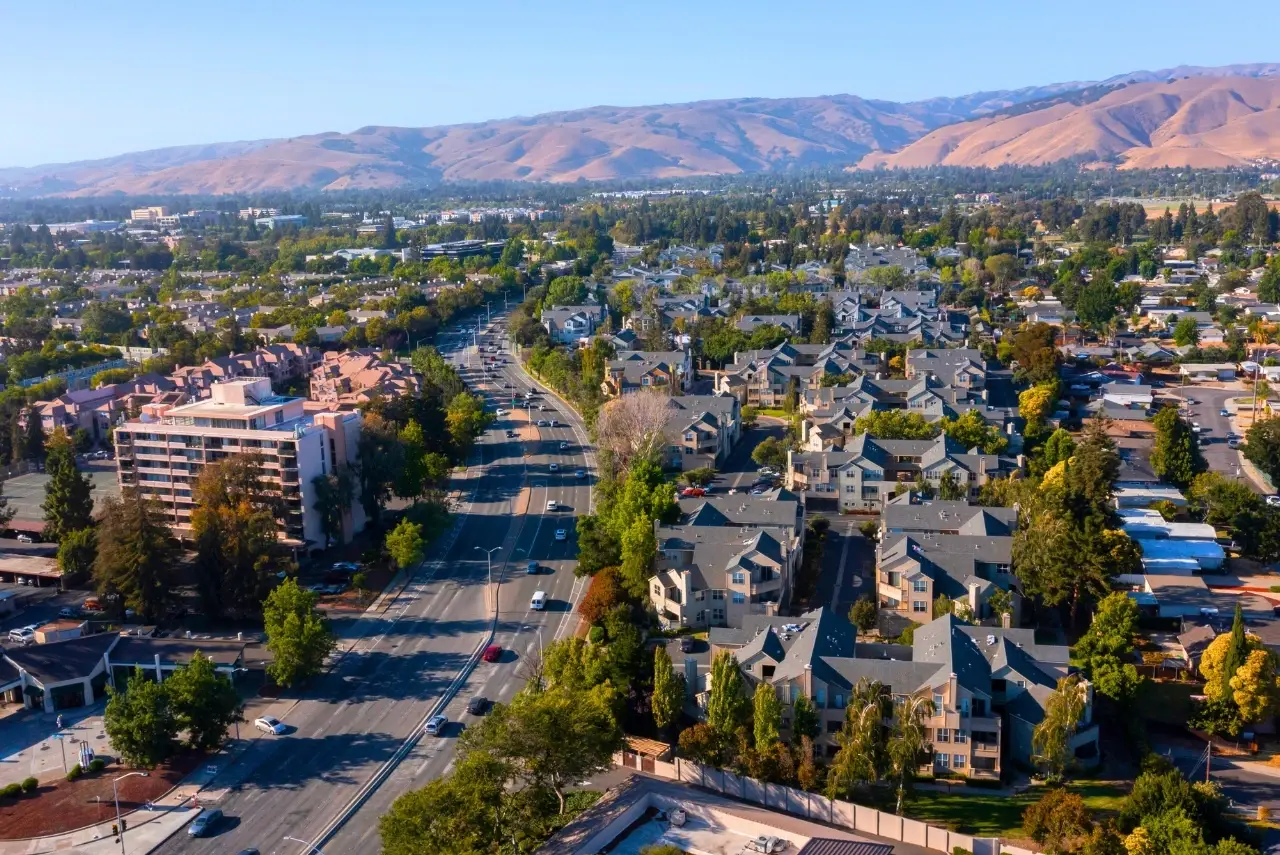 Aerial view of Fremont residential area and highways near the hills served by Website Design Fremont CA.