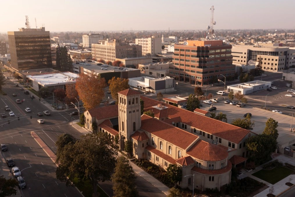 Aerial view of a historic church with a tower and city streets near Website Design Bakersfield CA