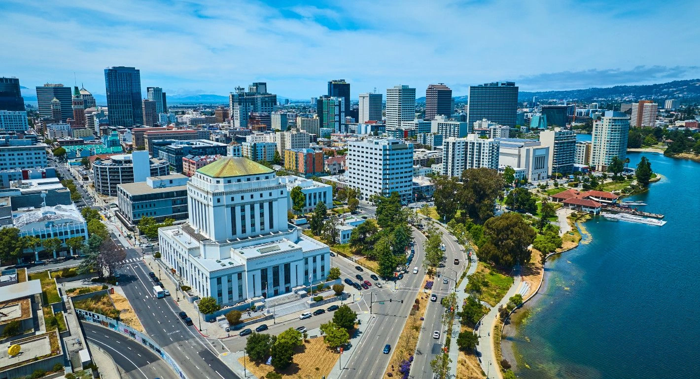 Aerial view of the white courthouse and blue lake waters near Website Design Oakland CA
