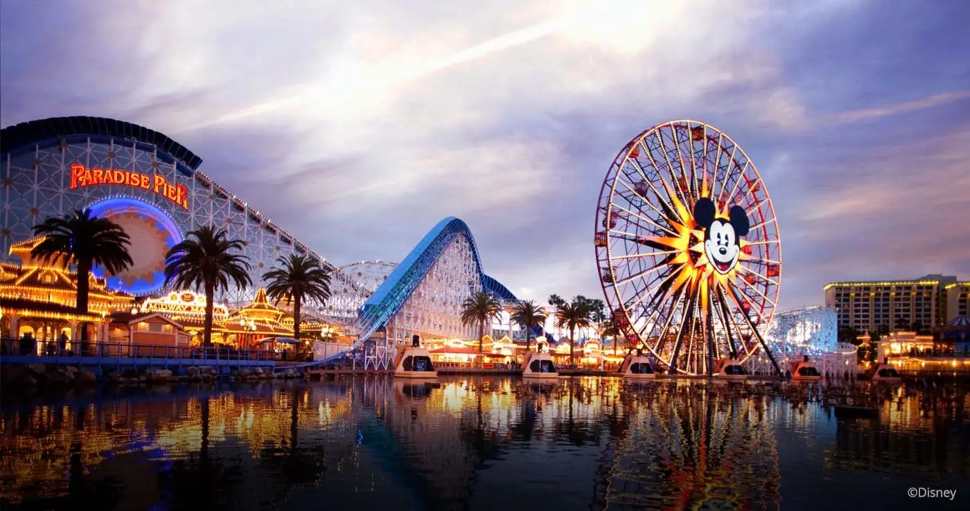 Illuminated Ferris wheel and coaster at Disney California Adventure near local Website Design Anaheim CA experts.
